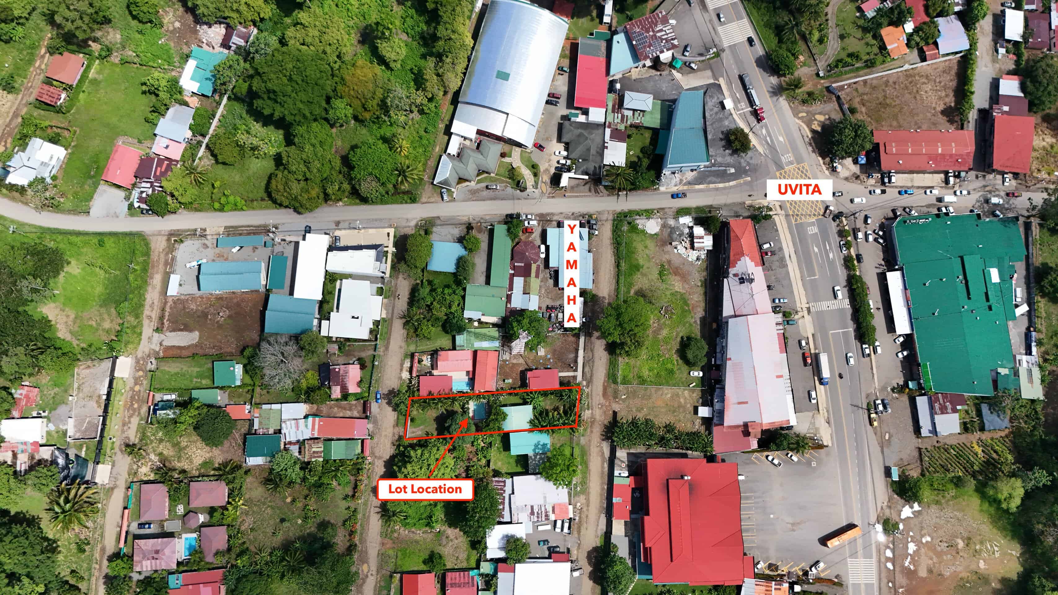 Aerial view of central Uvita with the two lots marked, one block from the main street