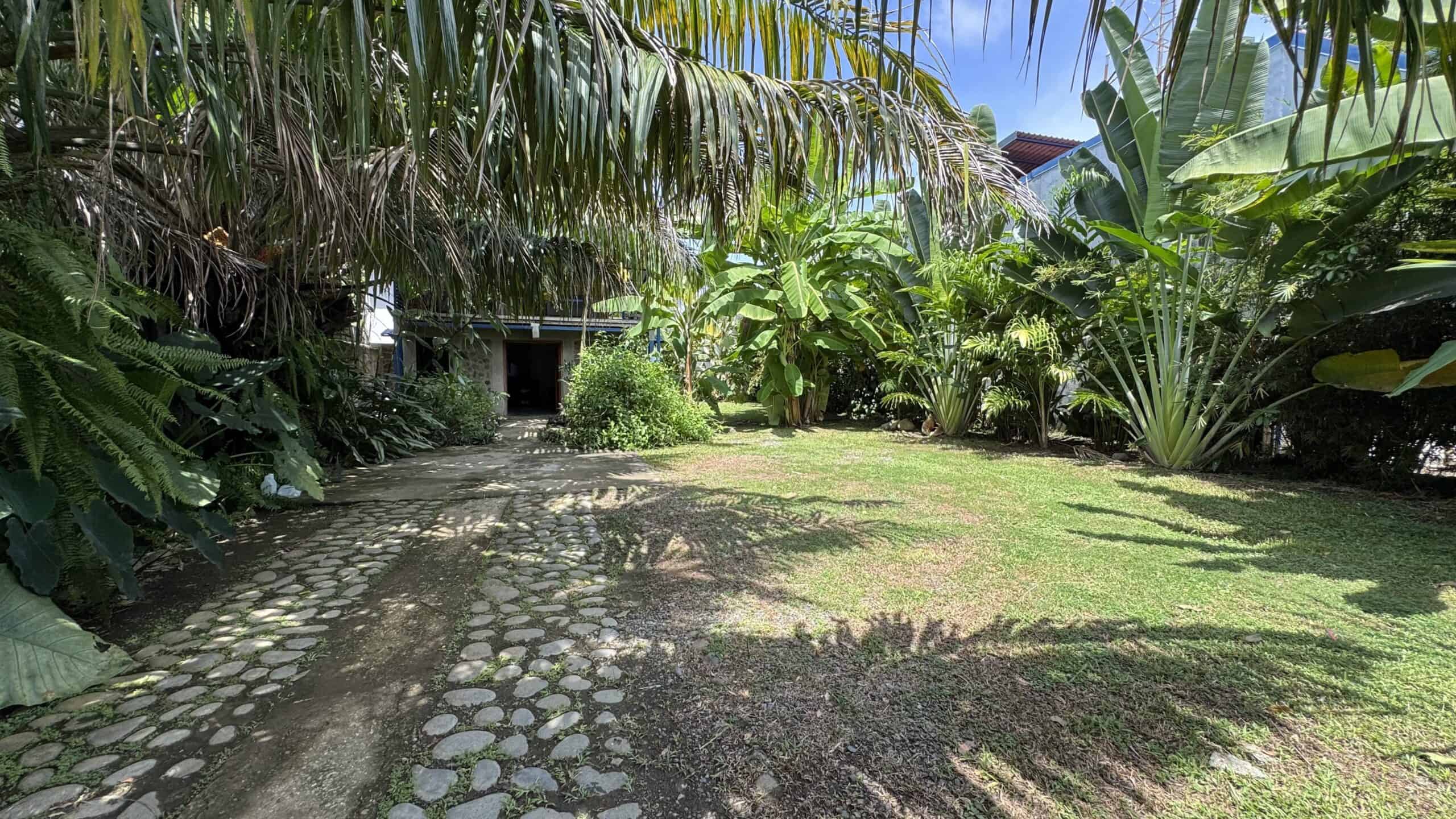 Stone driveway and flat garden on the property in Uvita