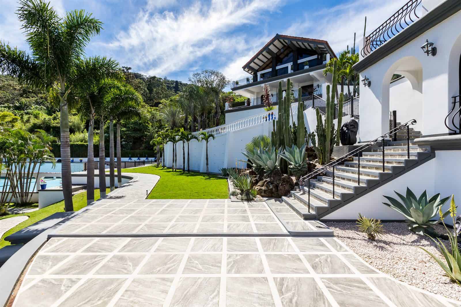 Stone driveway and entrance gardens