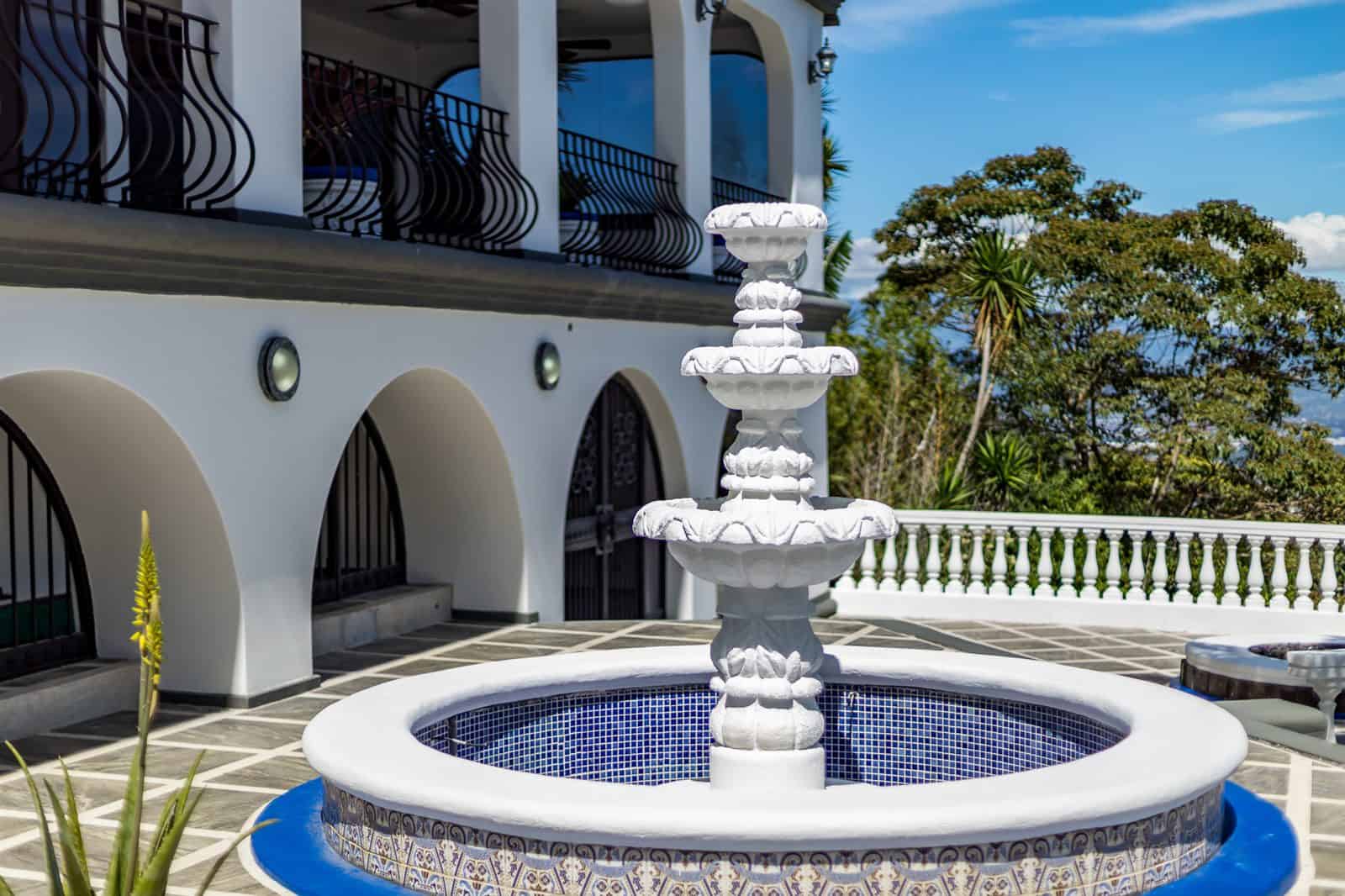 Tiled fountain in front of the arched terrace