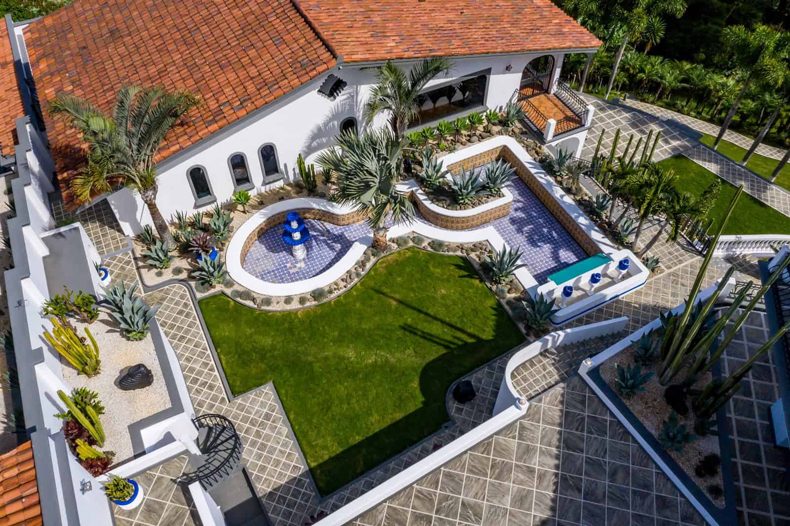 Garden terrace with fountain and lawn