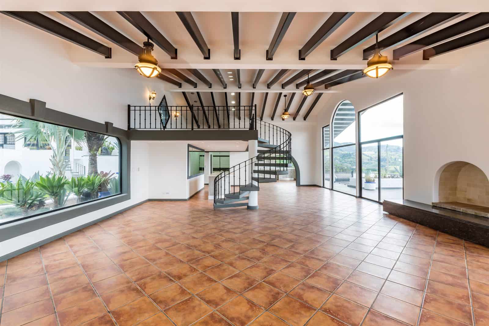 Great room with spiral stairs to the mezzanine