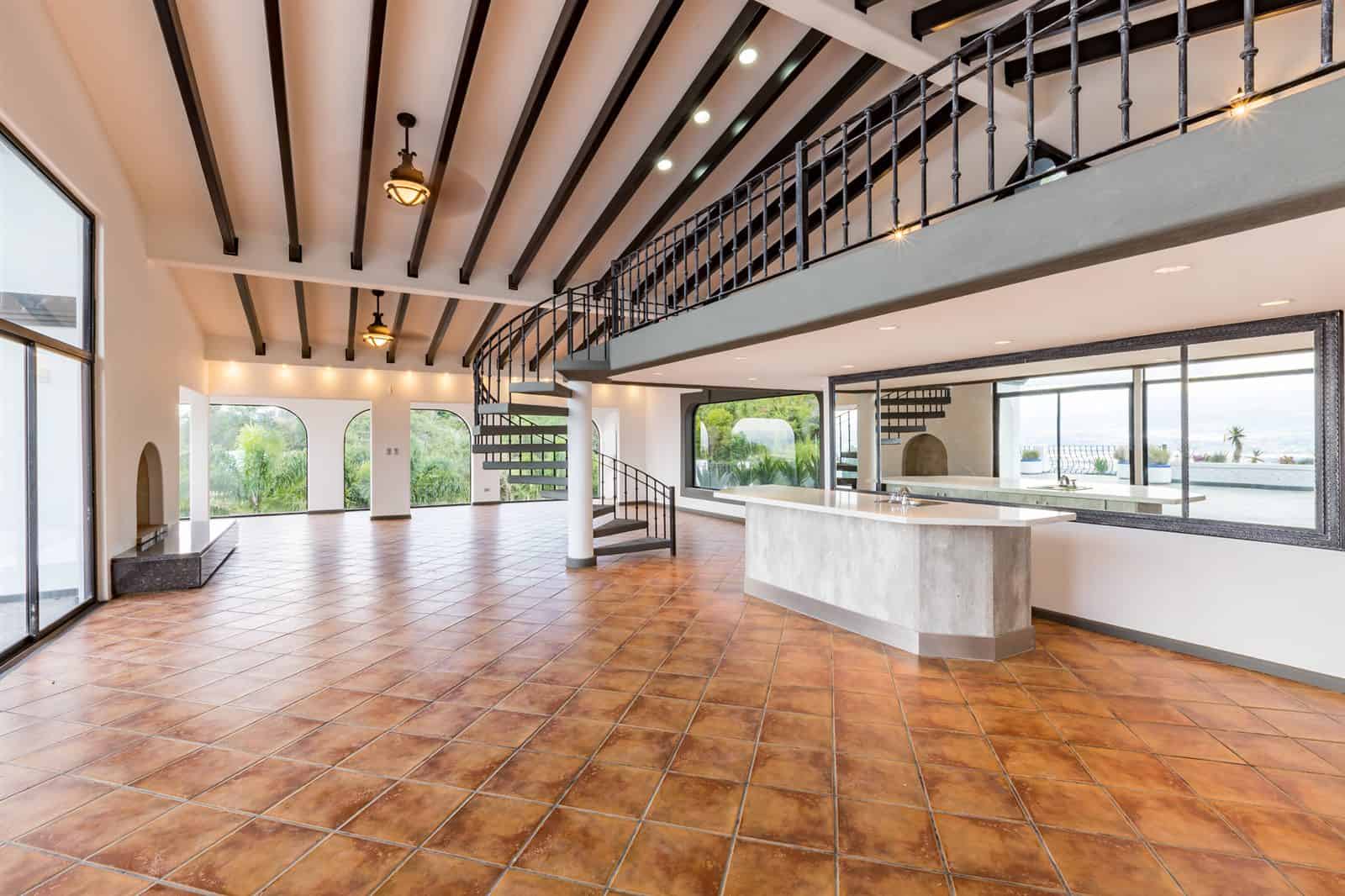 Great room with beamed ceiling and tile floors
