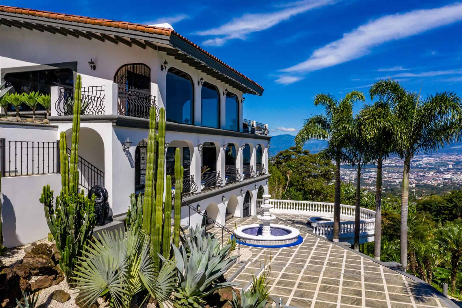 Main house with arched terraces and fountain