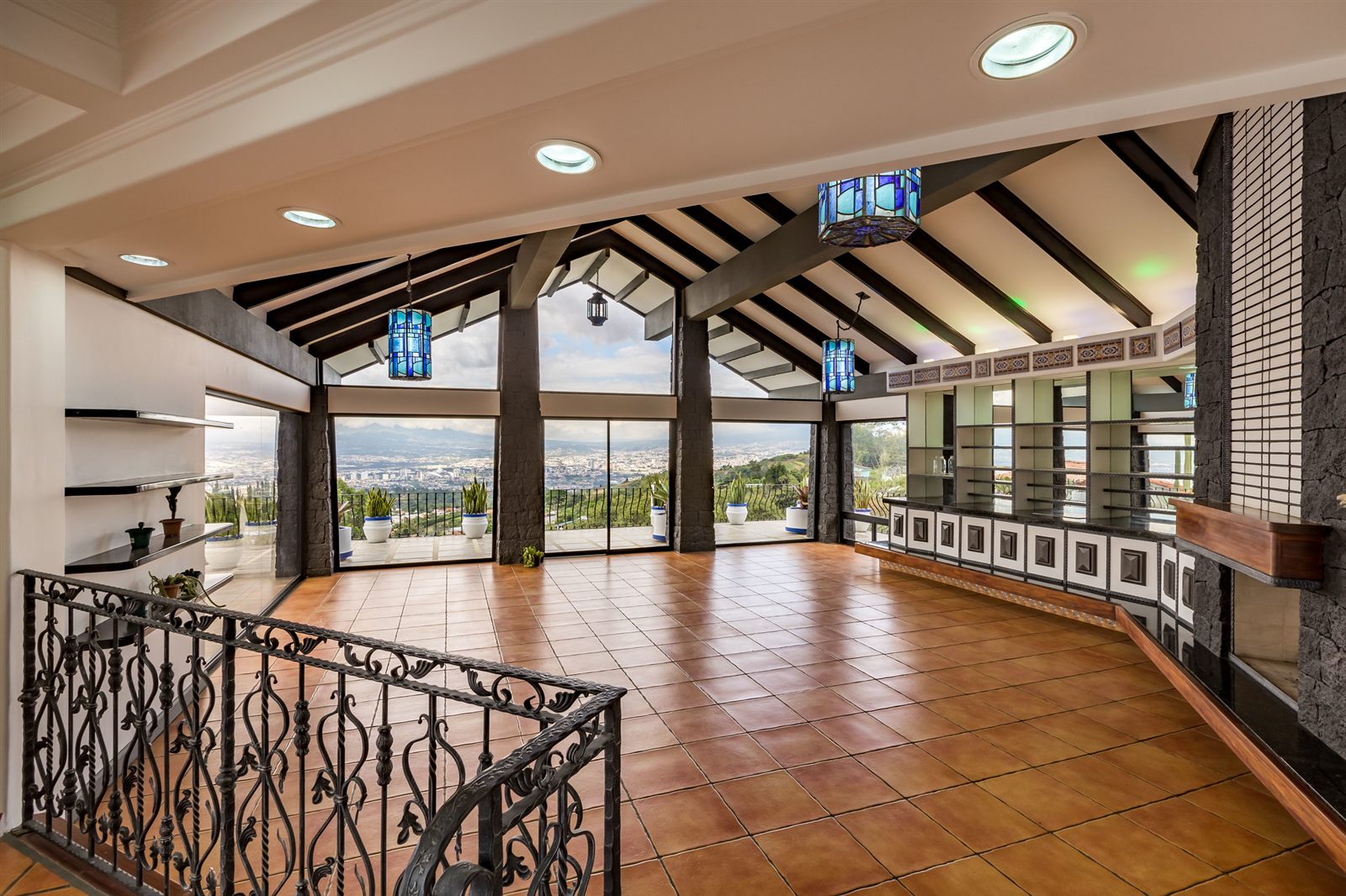 Vaulted living room with wall of windows