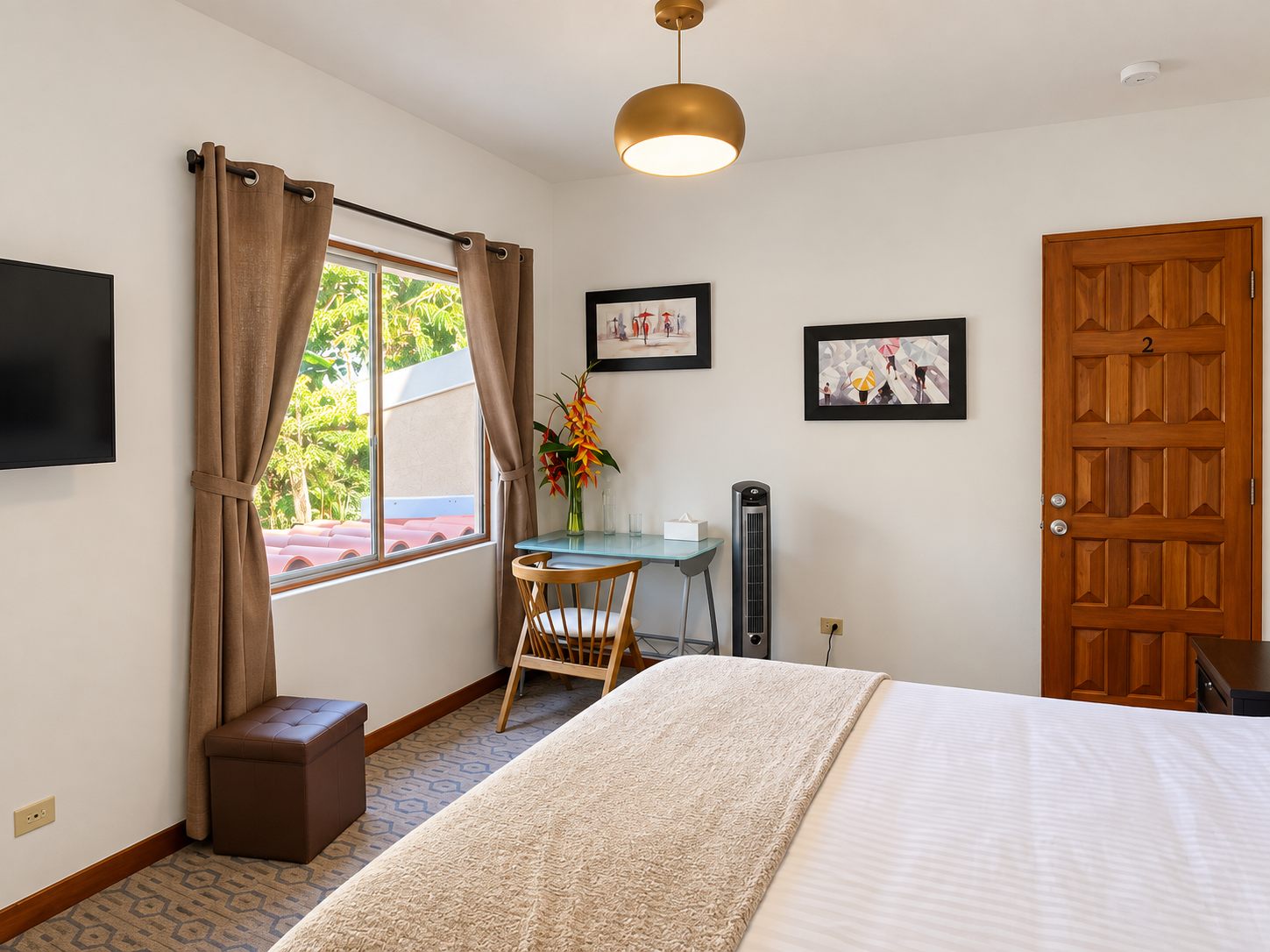 Bedroom with a desk, TV and window