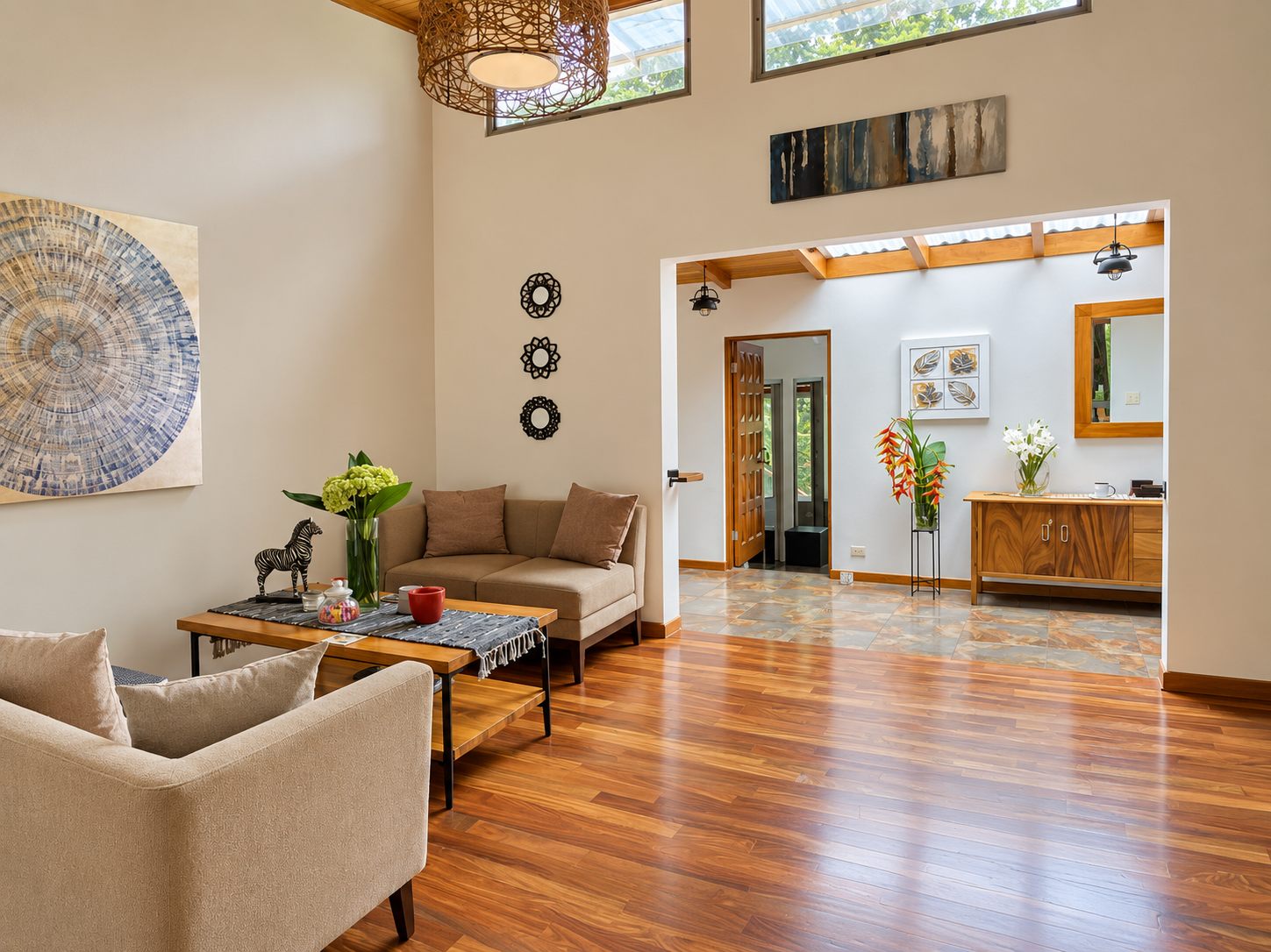 Den with wood floors and sofas