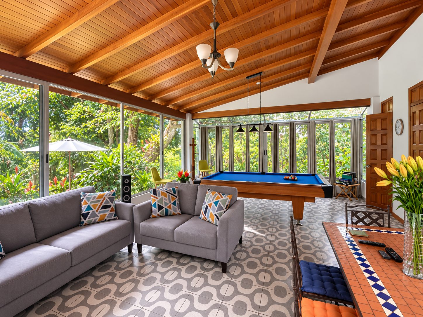 Garden room with sofas, pool table and dining by the windows