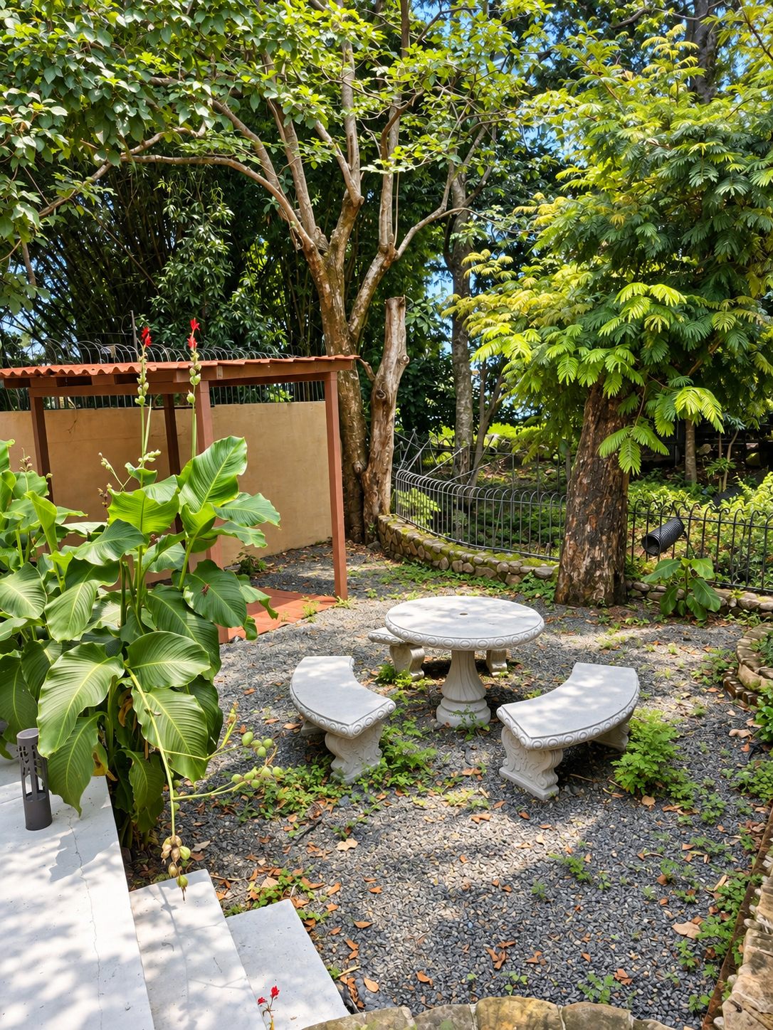 Shaded garden corner with a stone table and benches