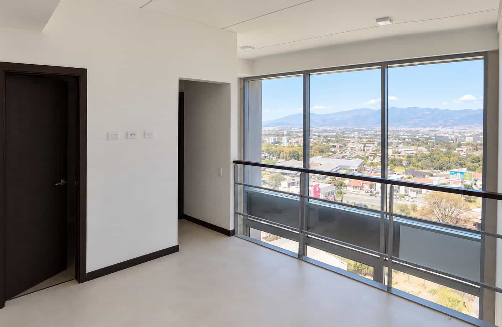 Living area with balcony and city view
