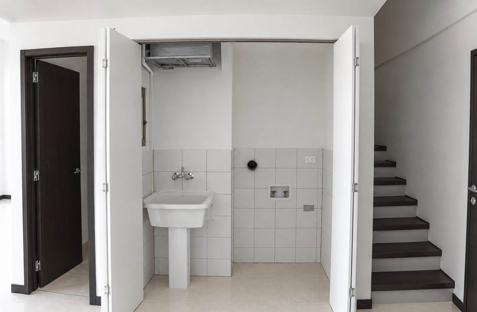Laundry area and stairs to the bedroom