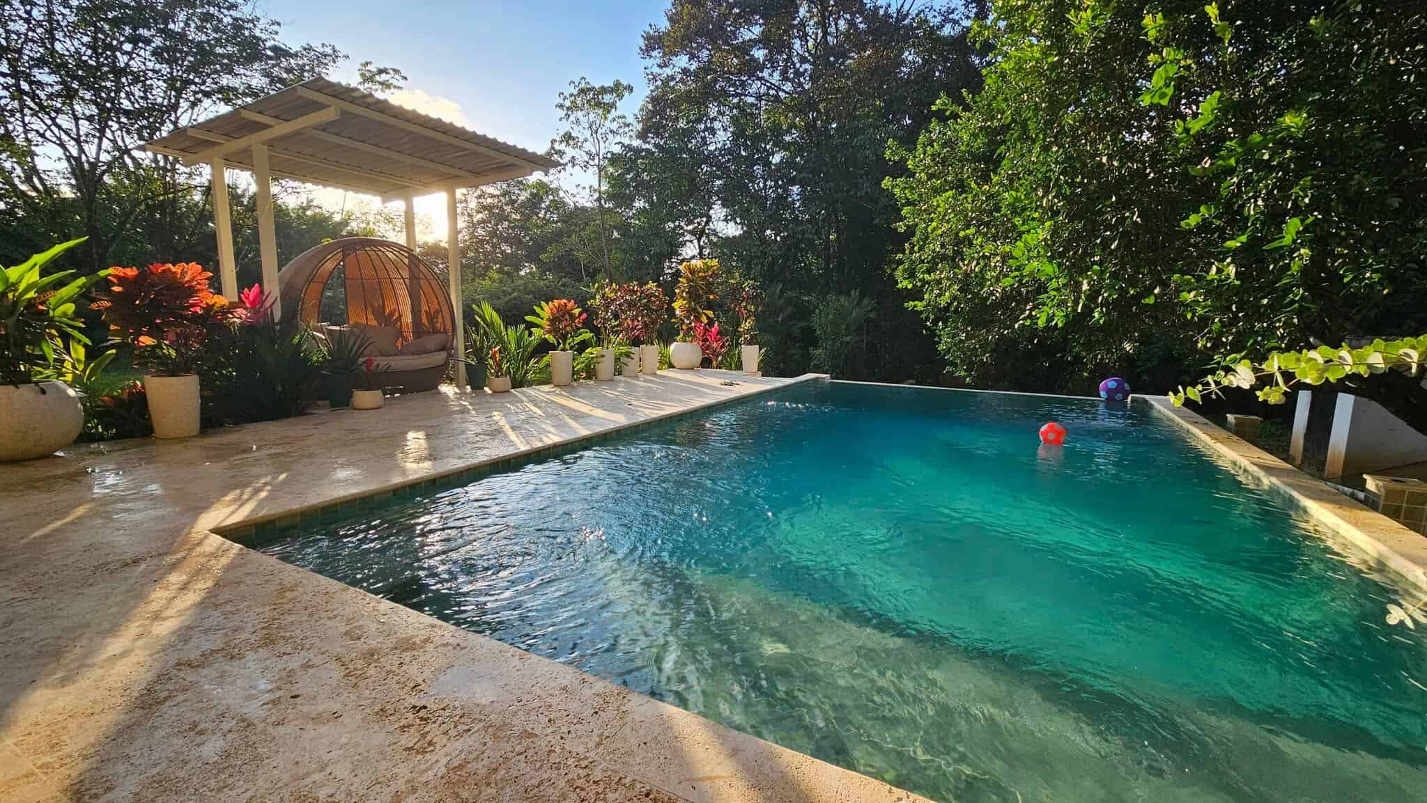Pool and tropical garden, Uvita riverfront duplex for sale