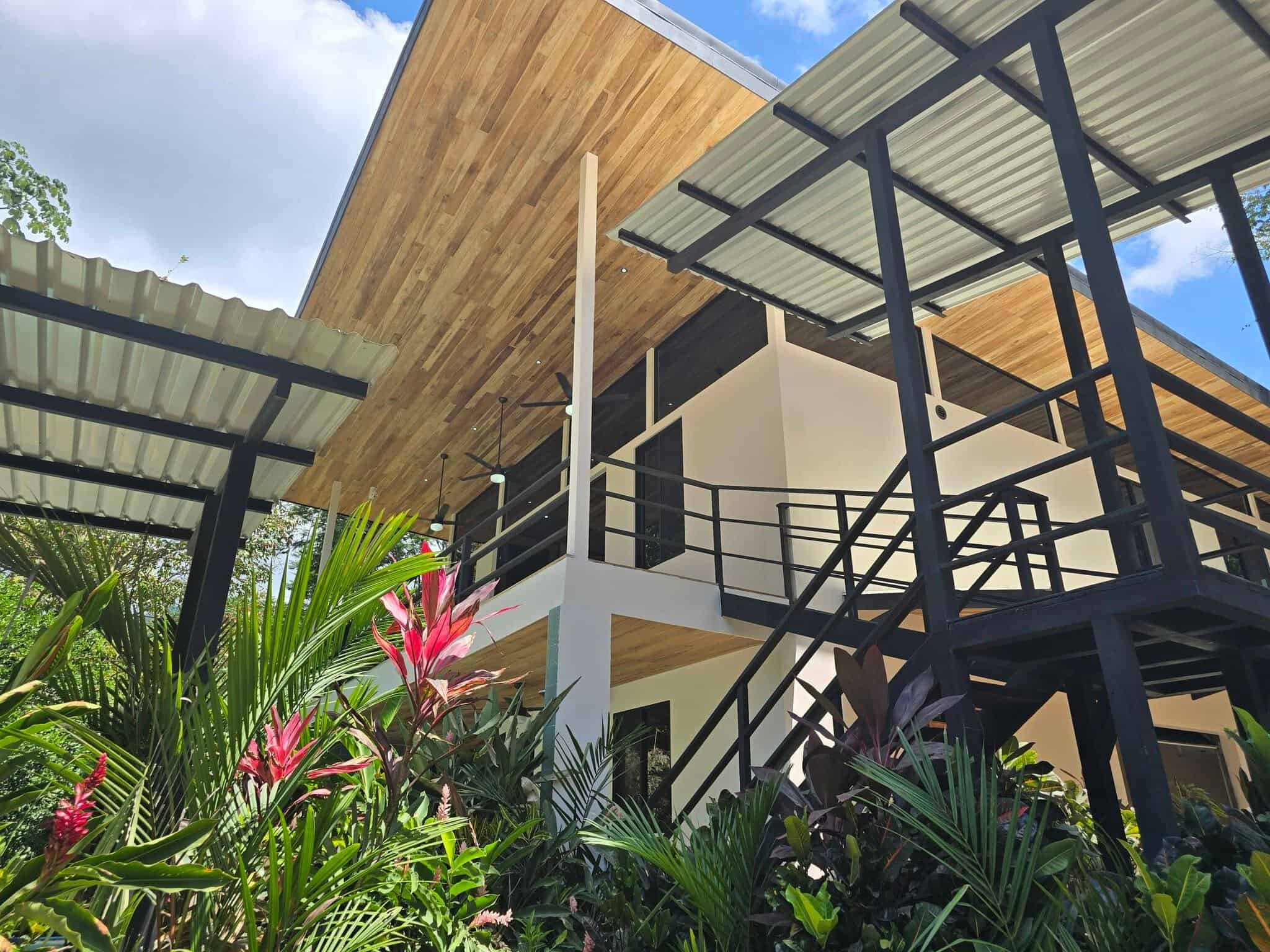 Contemporary design with tropical plants, Uvita riverfront duplex for sale
