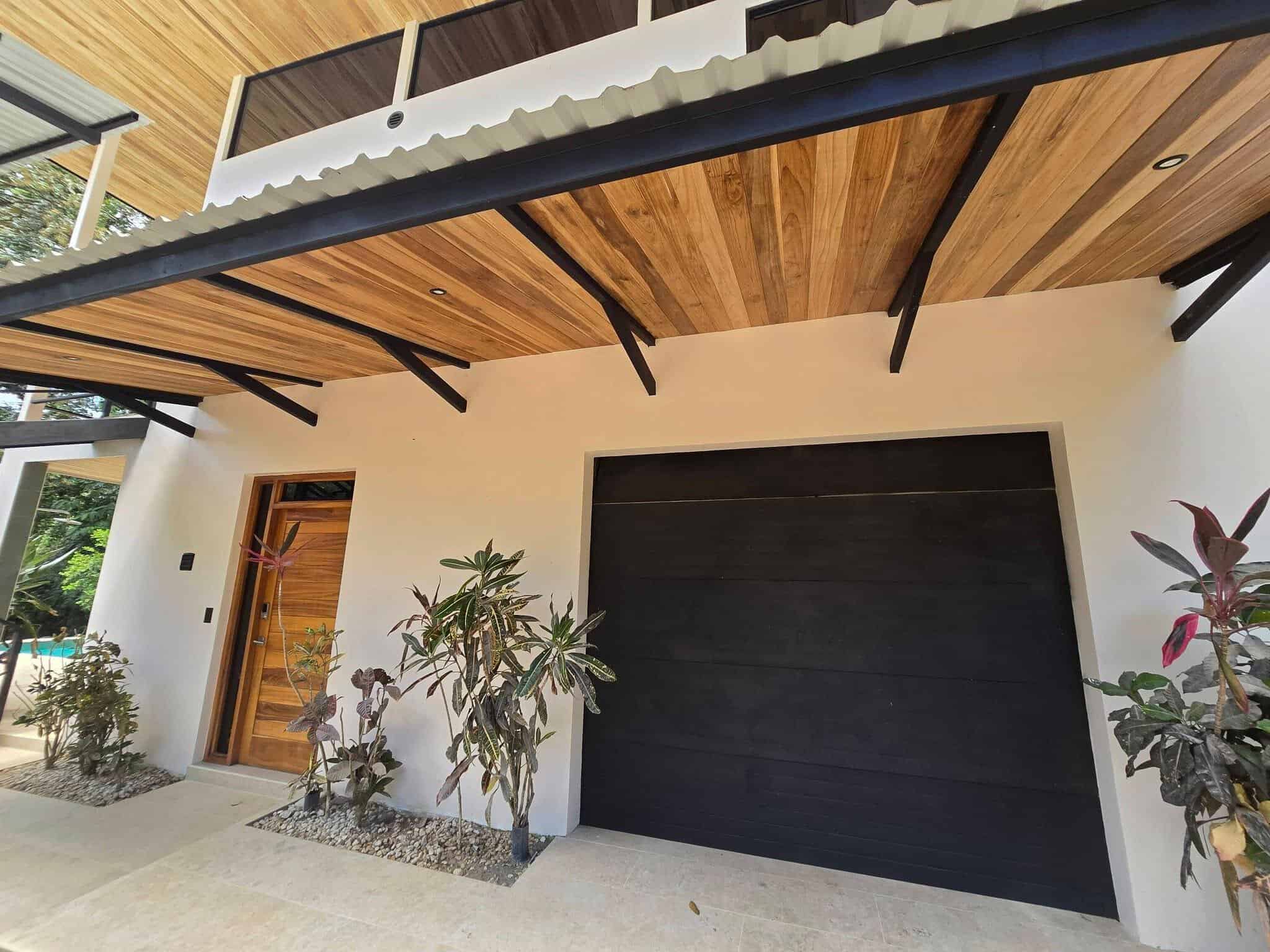 Enclosed garage and wood soffits, Uvita riverfront duplex for sale