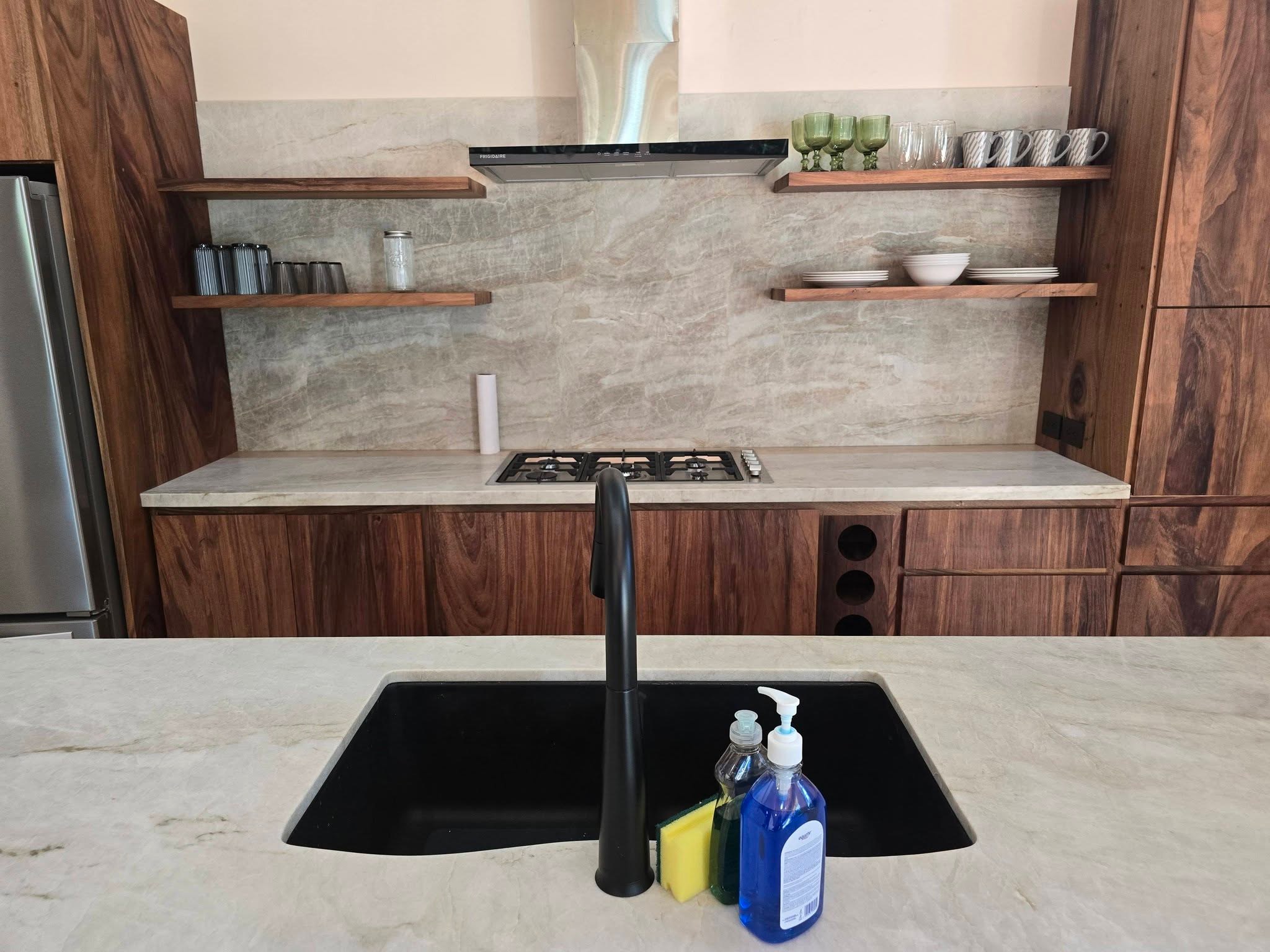 Kitchen with Taj Mahal quartzite counters, Uvita riverfront duplex for sale