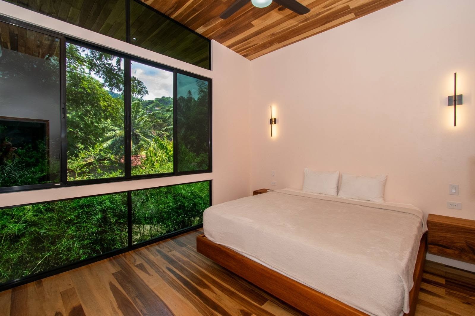 Bedroom with jungle windows, Uvita riverfront duplex for sale