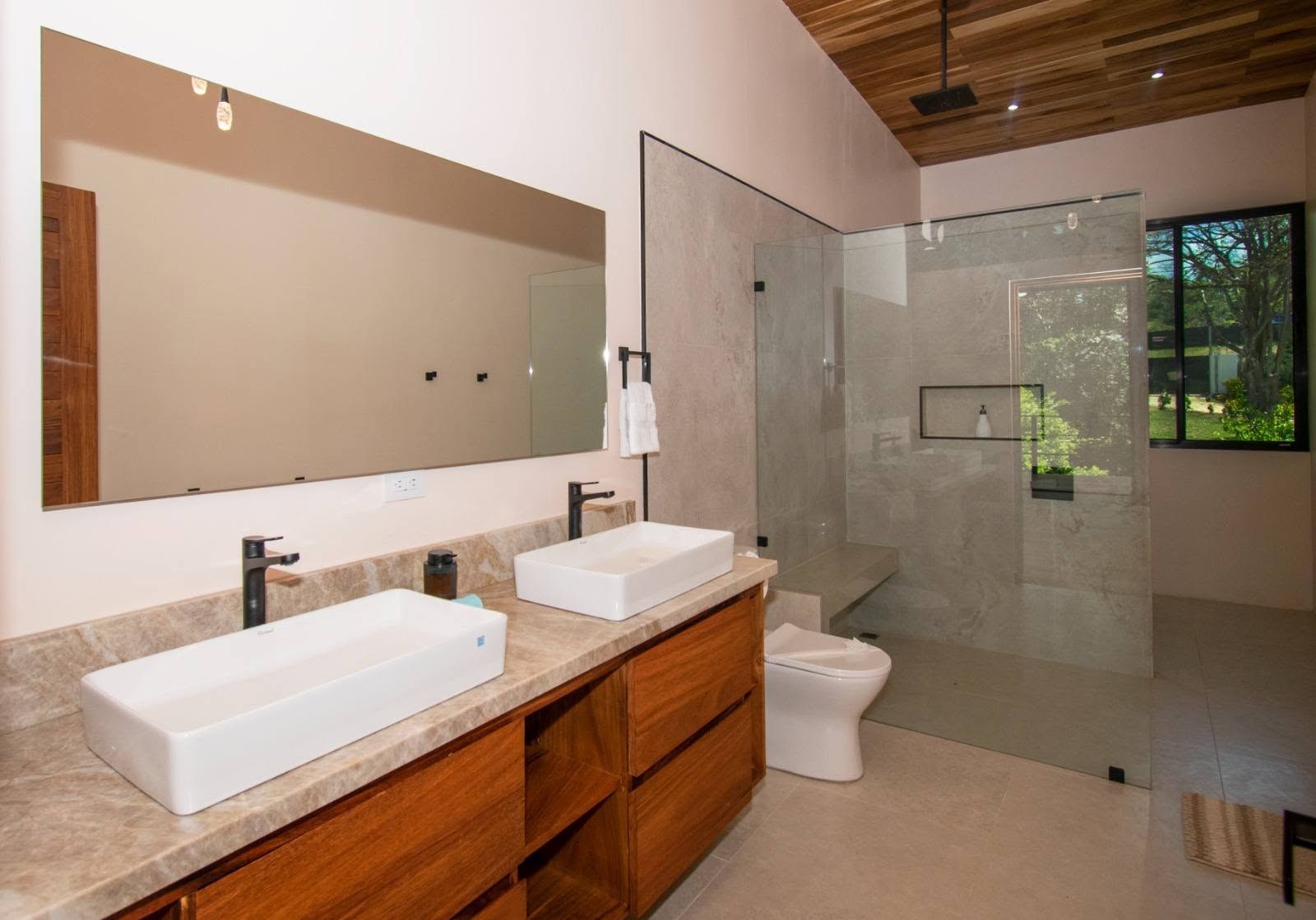 Ensuite bathroom with double sinks, Uvita riverfront duplex for sale