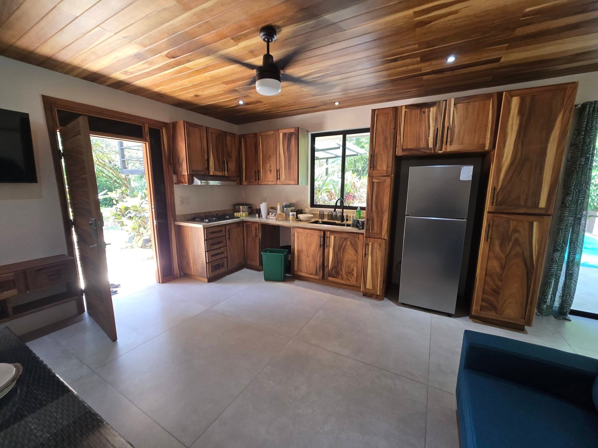 Lower unit kitchen and living area, Uvita riverfront duplex for sale